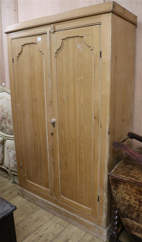 A pine two door wardrobe, W.117cm